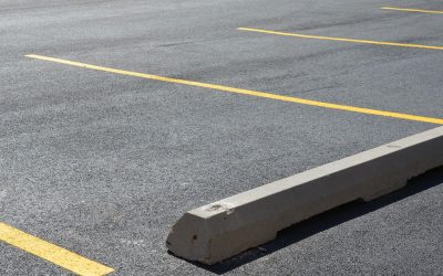 Pros and Cons of Concrete Vs. Rubber Parking Lot Wheel Stops