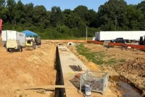 Completed concrete drainage structure and site grading at ABB Electrification project in Mississippi