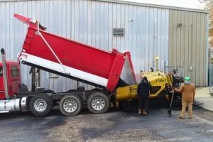 Asphalt paving operation underway at Orlando Health campus parking lot in Birmingham, Alabama